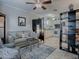 Open-concept living room with kitchen and room divider at 32314 Oak Park Dr, Leesburg, FL 34748