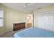 Bedroom with double bed, ceiling fan, and ample closet space at 3810 Cosmos Way, The Villages, FL 32163