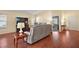 Open living room with hardwood floors and recessed lighting at 3810 Cosmos Way, The Villages, FL 32163