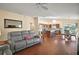 Open concept living room with kitchen and dining area views at 3810 Cosmos Way, The Villages, FL 32163