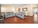 Living room with hardwood floors and comfortable seating at 3810 Cosmos Way, The Villages, FL 32163