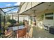 Outdoor patio with table and chairs, screened enclosure at 3810 Cosmos Way, The Villages, FL 32163