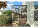 Side view of a screened patio with access from the house and yard at 3810 Cosmos Way, The Villages, FL 32163