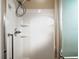 White shower with glass enclosure and built-in shelving at 3810 Cosmos Way, The Villages, FL 32163