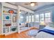 Bedroom with built-in shelving and mirrored closet doors at 422 W 11Th Ave, Mount Dora, FL 32757