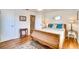 Bright bedroom with wooden flooring and a comfortable sleigh bed at 422 W 11Th Ave, Mount Dora, FL 32757