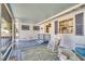 Screened porch with rocking chair and small table and chairs at 422 W 11Th Ave, Mount Dora, FL 32757