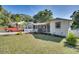 Charming house exterior with a classic design and well-manicured lawn at 422 W 11Th Ave, Mount Dora, FL 32757