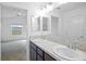 Double vanity bathroom with view into bedroom at 5820 Bamboo Ave, The Villages, FL 32163