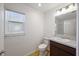 Clean bathroom with toilet, sink, and vanity at 5820 Bamboo Ave, The Villages, FL 32163