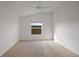 Well-lit bedroom with carpeted floors and a ceiling fan at 5820 Bamboo Ave, The Villages, FL 32163