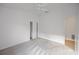 Well-lit bedroom with carpet, closet and door to another room at 5820 Bamboo Ave, The Villages, FL 32163