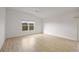 Bright bedroom with wood-look floors and ceiling fan at 5820 Bamboo Ave, The Villages, FL 32163