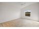Spacious bedroom with neutral carpeting and large window at 5820 Bamboo Ave, The Villages, FL 32163