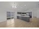 Modern kitchen with island and stainless steel appliances at 5820 Bamboo Ave, The Villages, FL 32163