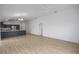 Open living room and kitchen with hardwood floors at 5820 Bamboo Ave, The Villages, FL 32163