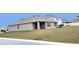 Single-story home with covered patio and spacious backyard at 716 Se 64Th Ter, Ocala, FL 34472