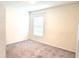 Empty bedroom with window and neutral walls at 716 Se 64Th Ter, Ocala, FL 34472