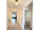 Bright hallway with tiled floor and chandelier at 716 Se 64Th Ter, Ocala, FL 34472
