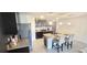 Modern kitchen with island, stainless steel appliances, and granite countertops at 716 Se 64Th Ter, Ocala, FL 34472
