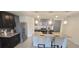 Modern kitchen with stainless steel appliances and an island at 716 Se 64Th Ter, Ocala, FL 34472