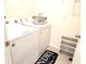 Bright laundry room with washer, dryer, and storage at 716 Se 64Th Ter, Ocala, FL 34472