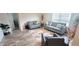 Spacious living area featuring two sofas, a chair, and large windows at 716 Se 64Th Ter, Ocala, FL 34472