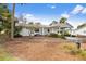 House exterior showcasing a carport and walkway at 73 Stone Haven Ct, Leesburg, FL 34788