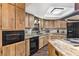 Kitchen with granite countertops and wood cabinets at 73 Stone Haven Ct, Leesburg, FL 34788