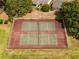 Two well-maintained tennis courts at 73 Stone Haven Ct, Leesburg, FL 34788