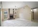 Living room featuring a brick fireplace and large windows at 10042 Chesham Dr, Orlando, FL 32817