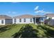 Large backyard with grassy area and home view at 1109 Catskill Dr, Haines City, FL 33844