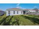Spacious backyard with grassy area and home view at 1109 Catskill Dr, Haines City, FL 33844