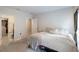 Bright bedroom with a queen bed and ensuite bathroom at 1109 Catskill Dr, Haines City, FL 33844