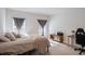 Spacious bedroom with large bed, window, and workspace at 1109 Catskill Dr, Haines City, FL 33844