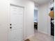 White door and view into bedroom with tile floor at 1109 Catskill Dr, Haines City, FL 33844