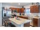Kitchen with stainless steel appliances and wood cabinets at 1109 Catskill Dr, Haines City, FL 33844