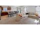 Open living room and kitchen with beige sectional sofa at 1109 Catskill Dr, Haines City, FL 33844