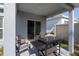 Covered patio with grill and outdoor furniture at 1109 Catskill Dr, Haines City, FL 33844