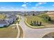 Waterside community entrance view, showing houses and a lake at 136 White Horse Way, Groveland, FL 34736