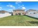 Large backyard with a privacy fence at 136 White Horse Way, Groveland, FL 34736