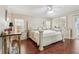 Spacious bedroom with a king-size bed and dark hardwood floors at 1420 Skyline Dr, Tavares, FL 32778