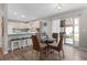 Kitchen dining area with glass table and wicker chairs at 1622 Tampico Pl, The Villages, FL 32159