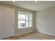 Bright living area with a large window and wood-look tile floor at 16484 Tangerine Mesa Dr, Winter Garden, FL 34787