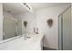 Bathroom with double vanity, large mirror, and shower at 17640 Se 81St Timberwood Ter, The Villages, FL 32162