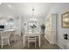 Bright dining area with a glass-top table and white hutch at 17640 Se 81St Timberwood Ter, The Villages, FL 32162