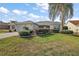 Single-story home with landscaped front yard and palm tree at 17640 Se 81St Timberwood Ter, The Villages, FL 32162