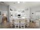 White kitchen with an island, stainless steel appliances and quartz countertops at 17640 Se 81St Timberwood Ter, The Villages, FL 32162