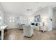 Living room with whitewashed walls, comfy seating, and tiled floors at 17640 Se 81St Timberwood Ter, The Villages, FL 32162