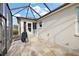 Relaxing screened patio with flagstone flooring and access to the house at 17640 Se 81St Timberwood Ter, The Villages, FL 32162
